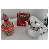6 pack coke bottles, teapot, plastic covered wine