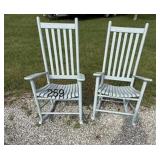 2 grey wooden rocking chairs