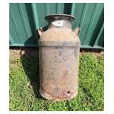Milk can. Rusted at bottom