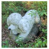 Cement statue of poodle