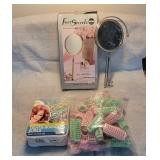 Magnifying mirror & old curlers