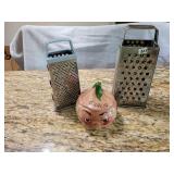 2 metal graters. Old garlic jar