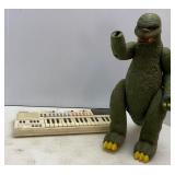 Casio Keyboard & Godzilla (missing a hand)