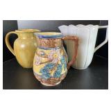 Assorted Pottery Pitchers Including Henriksen