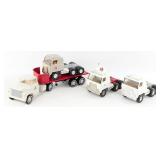 (4) Ertl International Trucks and (1) Trailer