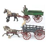 (2) Cast Iron Horse Drawn Wagons