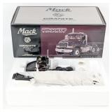 1/34 First Gear Mack Granite Semi with Lowboy Trai