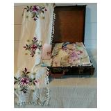 Vintage luggage with handkerchiefs table runners