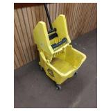 Yellow commercial mop bucket