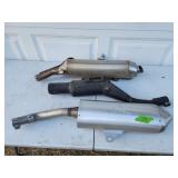 Three mufflers from BMW motorcycles and others