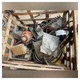 Crate of assorted small engine parts and belts