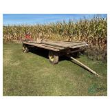Flatbed wagon on John Deere running gear, 7.5 ft x 14 ft