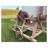 Vintage Buzz saw on steel wheel trailer, belt drive