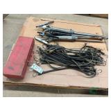 Pallet of bungy straps drum pumps and triangles