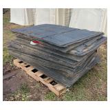 Stack of 57 1/2" x 39" rubber mats, row:5