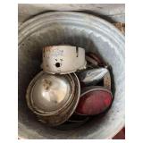 Volkswagen parts- old gauges, misc. headlight & taillight brackets, bldg:green