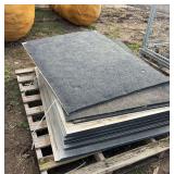 Stack of 43 1/2" x 55" rubber mats, row:5