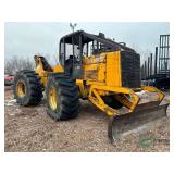John Deere 640 log skidder with flat tire