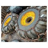 2 Log skidder tires on rims with chains