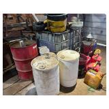 Assorted gas can and oil barrels and more
