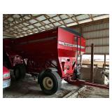 Unverferth 530 gravity wagon with brakes, lights, and roll tarp