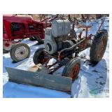 Vintage Gibson tractor with plow
