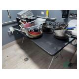Table and contents of Frying pans, storage bins
