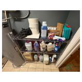 Metal rack and contents of cleaning supplies