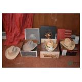 (3) Cowboy hats and one is a hard hat