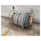 Spool of 4 inch rubber manure hose