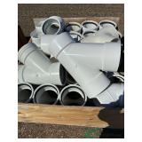 Crate of numerous PVC fittings