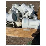 Crate of numerous PVC fittings