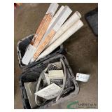 Totes of plumbing and ventilation parts