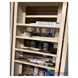 Contents of cabinet, spray paints, solvents and misc.