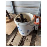 Bucket of trailer hitches, bldg:locked