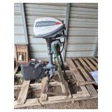 14 hp Evinrude motor with stand, bldg:green