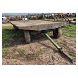 Flat rack hay wagon with John Deere running gear, row:8