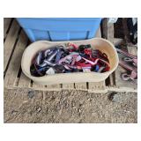 Bin of heated & nonheated water dishes & bin of leashes, bldg:green