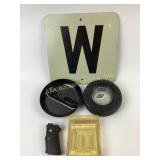 Metal W sign, Goodyear ashtray, Smith and Wesson
