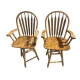 2 oak swiveling counter height chairs