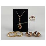 .925 Sterling Silver: Gold toned and green stone