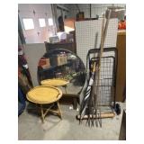 Circle Mirror, pegboard, cart, pitchforks