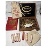 Pennies in cigar box, coin book, bank bag