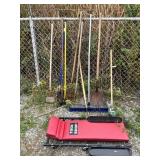 Garage creeper, shovels, brooms, tools