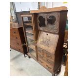 Wood secretary with drawers and shelves.