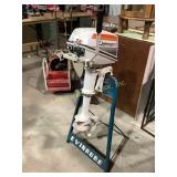 Johnson 4 outboard moter and stand. Untested