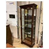 Lighted curio cabinet with sliding door