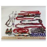 Costume Jewelry: Purple flower necklace, red bead