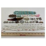 Costume Jewelry: Bakelite feather pin, faceted