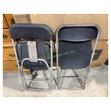 2 plastic and metal folding chairs